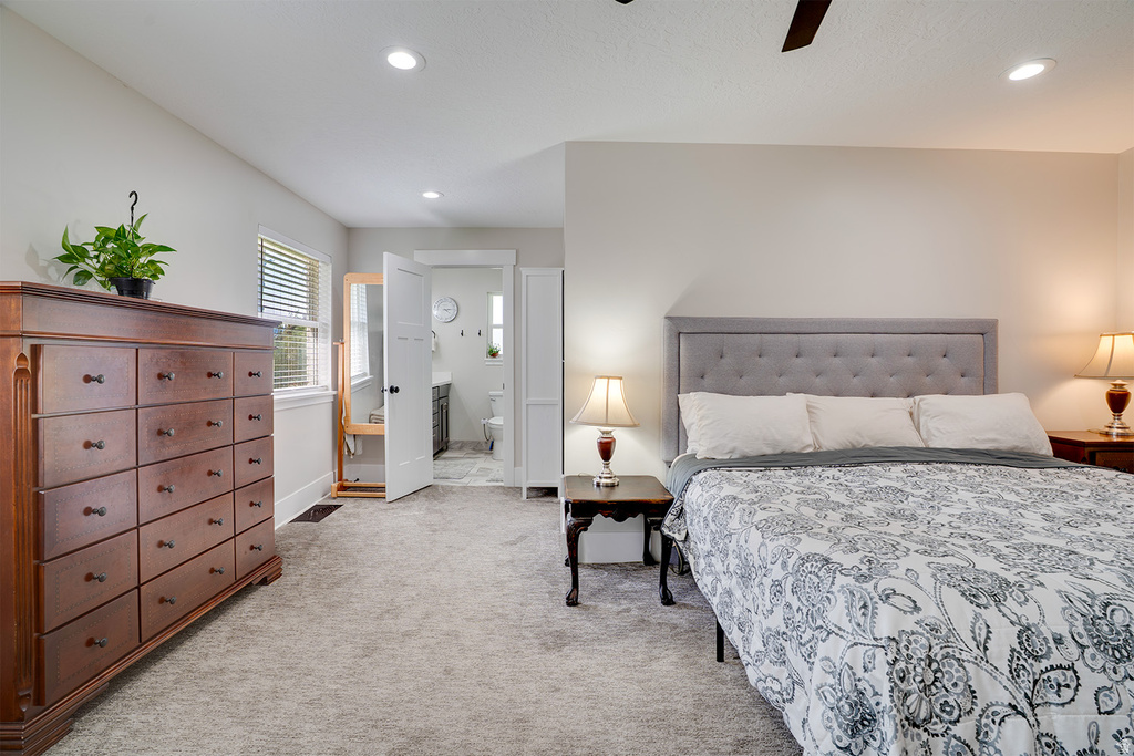 Bedroom featuring light gray carpeting, recessed lighting, ceiling fan, and a window with horizontal blinds