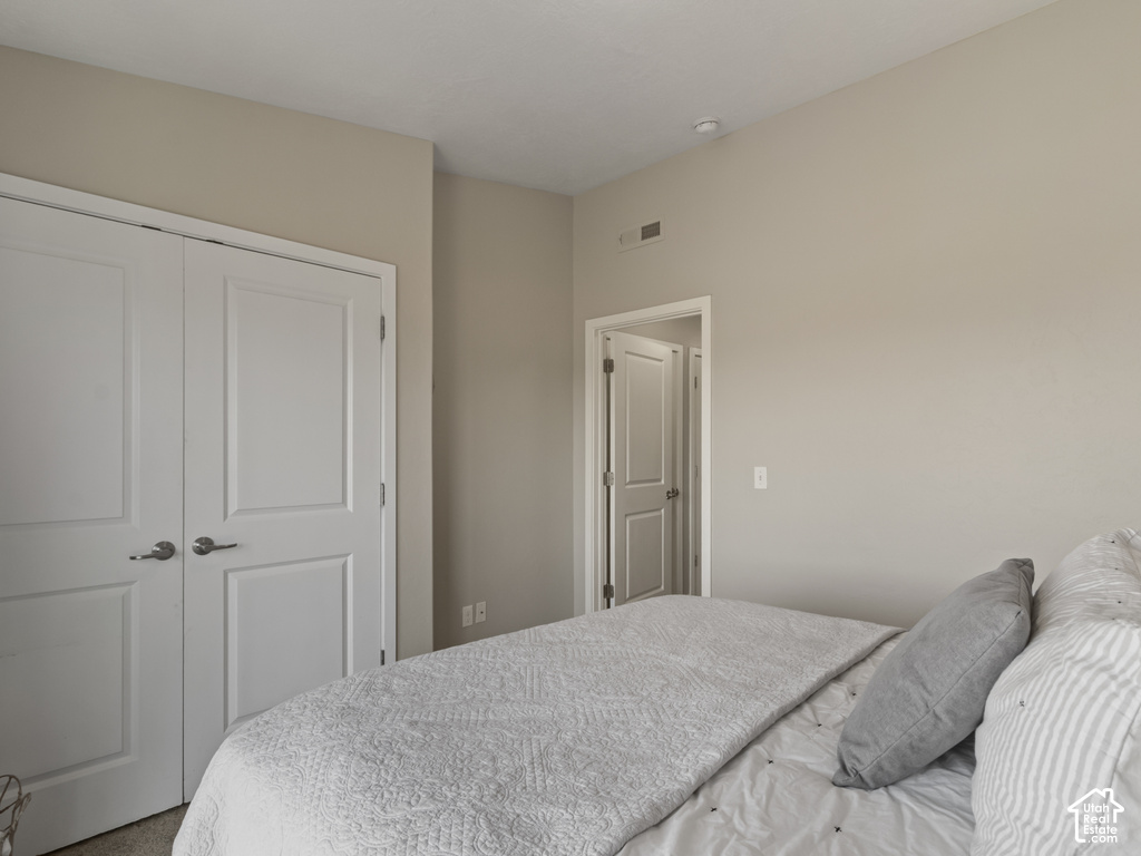 Interior room featuring light neutral wall paint, white trim, and white paneled doors with brushed nickel hardware