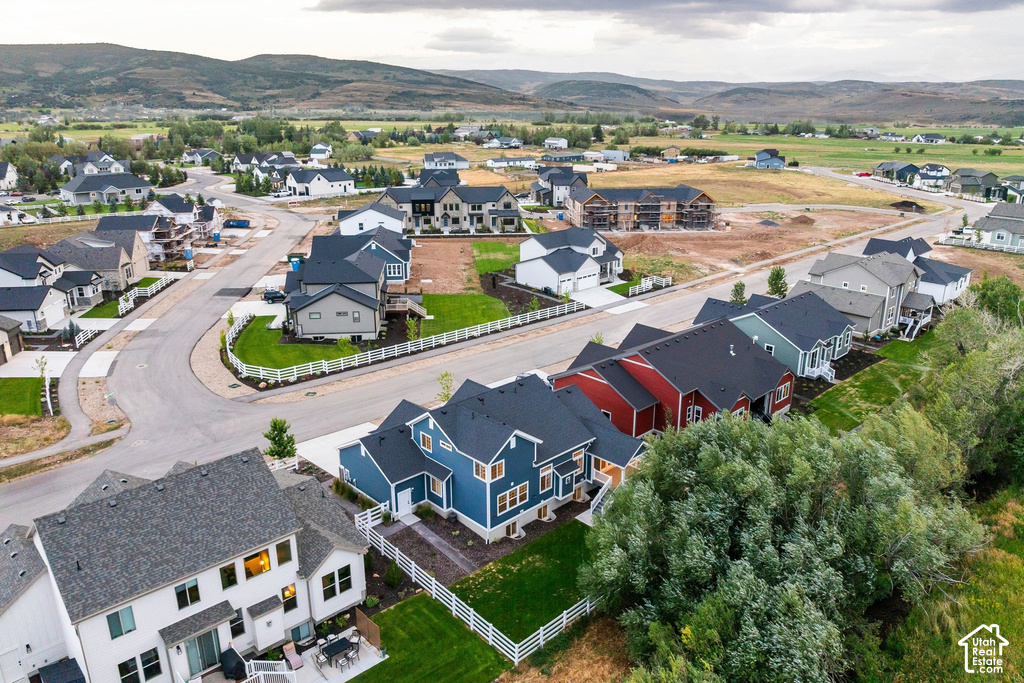 Established residential development featuring modern homes with dark roofs and light siding