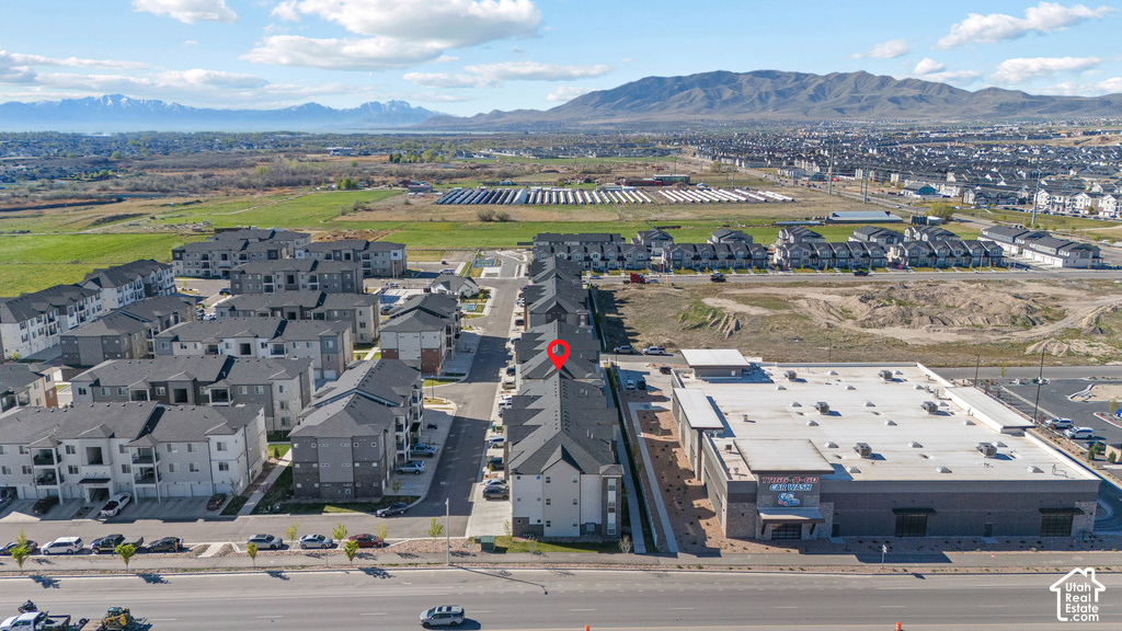 Aerial view of contemporary residential community featuring newly constructed multi-unit buildings with modern architectural design, flat rooflines, and clean geometric facades
