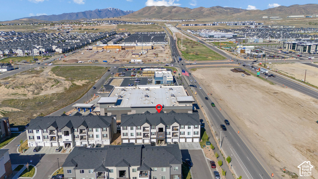 Newly constructed multi-unit residential complex featuring clean-lined architecture with white exterior finishes and dark roofing