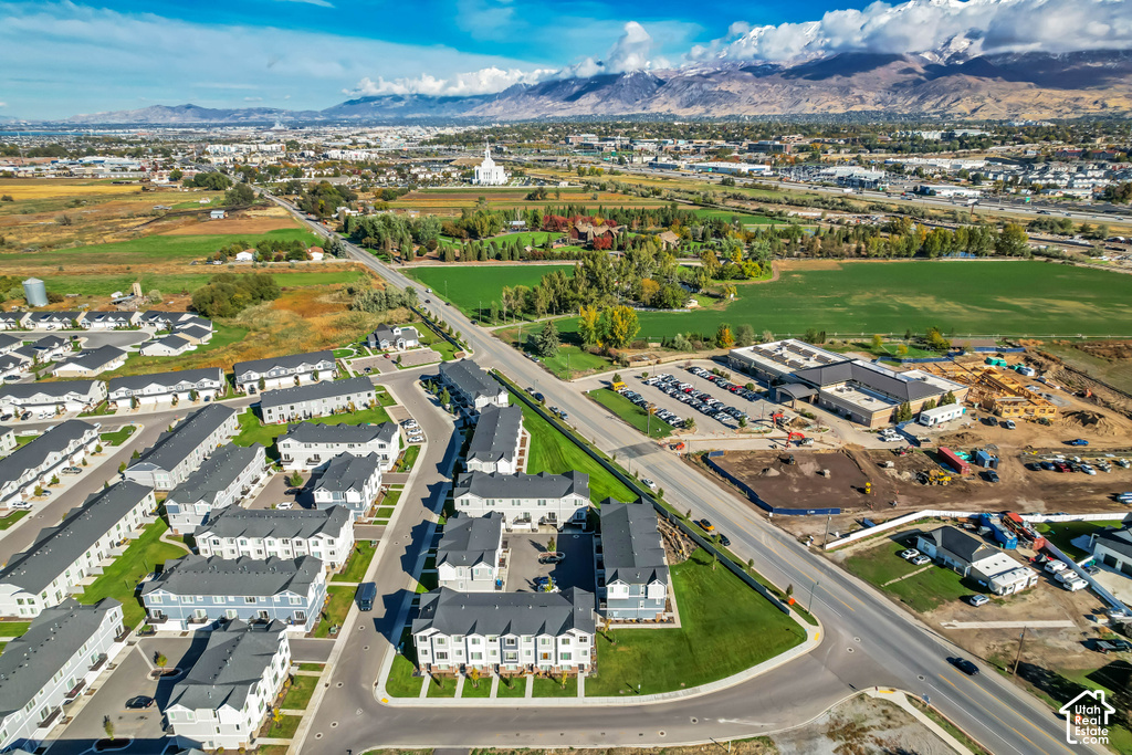 Aerial perspective showcasing a residential development with townhomes and single-family residences