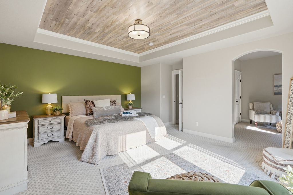 Recessed tray ceiling with wood-finish paneling, complemented by a contemporary flush-mount light fixture
