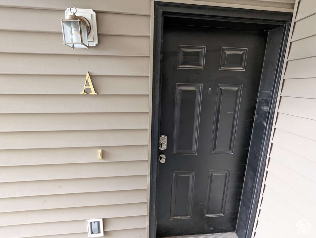 Panel-style entry door with a deadbolt and doorknob