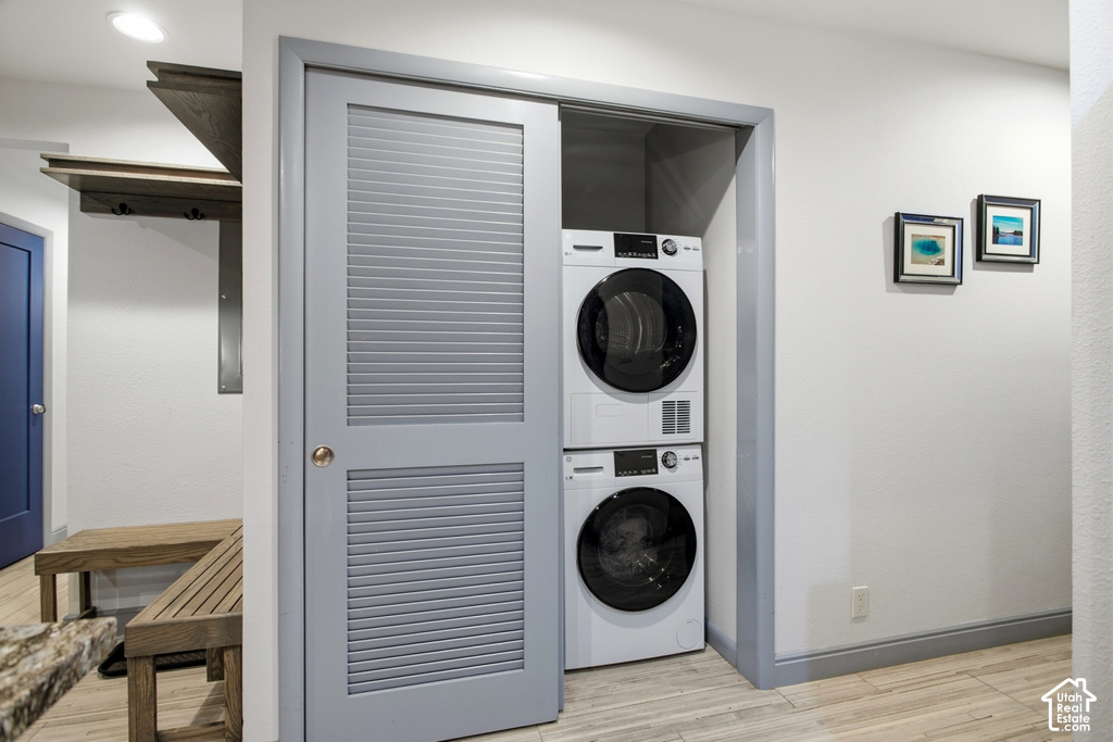 Stackable washer and dryer combination within a louvered bi-fold door closet