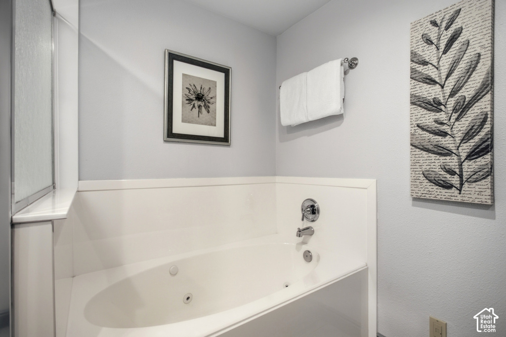 Jetted soaking tub with chrome fixtures