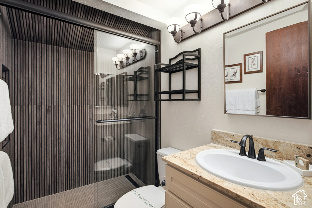 Shower with vertical wood-finish paneling and sliding glass door