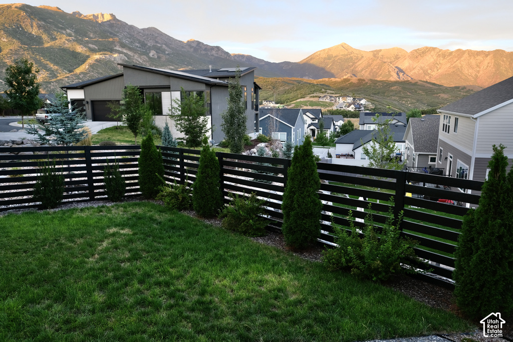 Lawn area with a black horizontal slat fence
