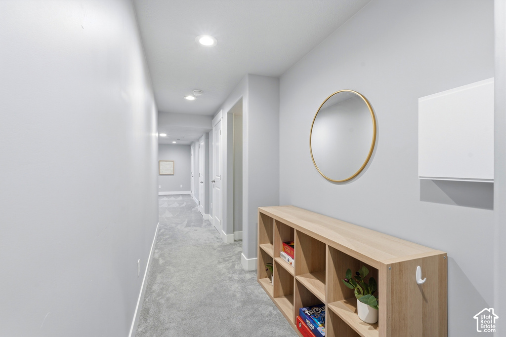Hallway featuring recessed lighting, paneled doors, and carpeting