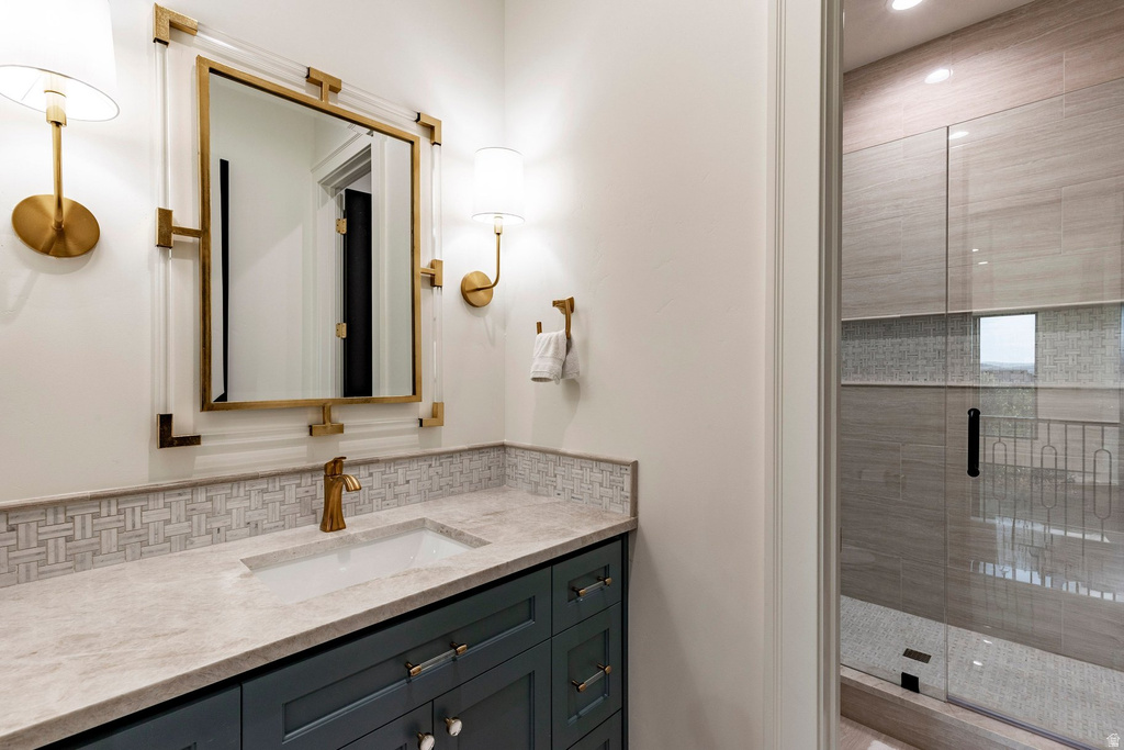 Vanity with integrated sink, gold-finish faucet, and coordinating mirror