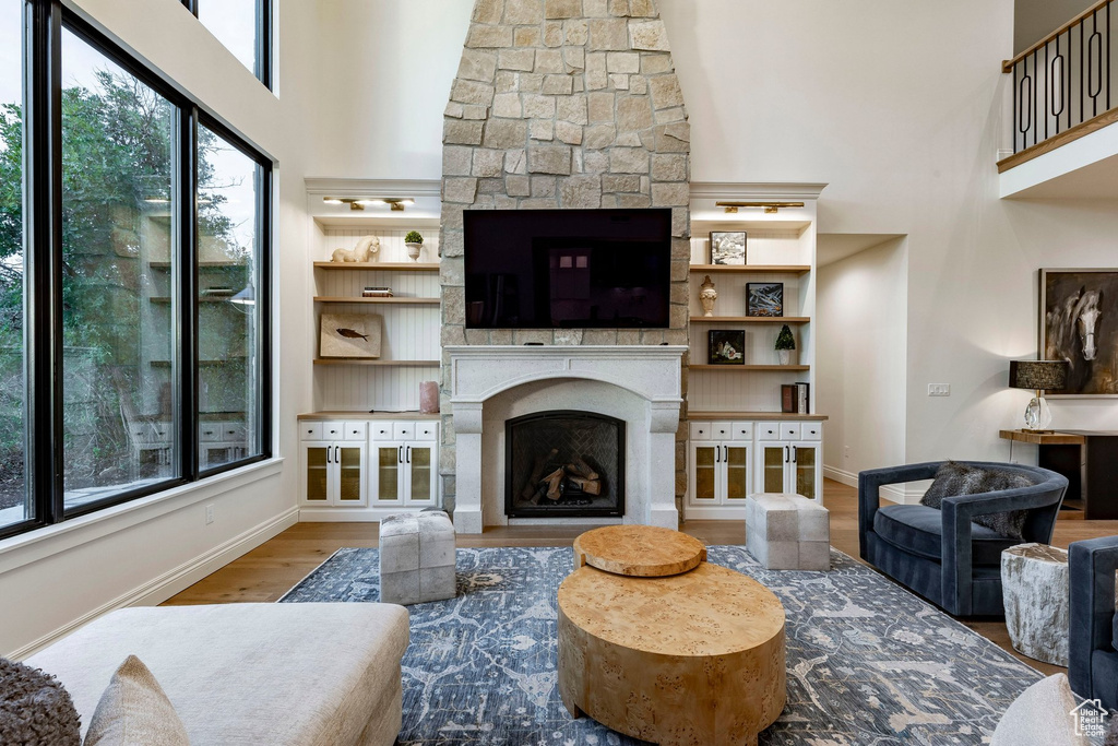 Soaring ceiling with stone fireplace and hearth