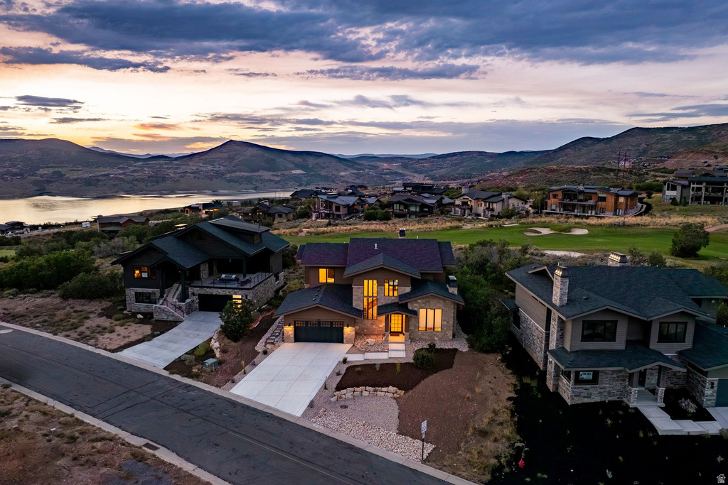 Modern contemporary architecture featuring extensive stone cladding and multiple large windows