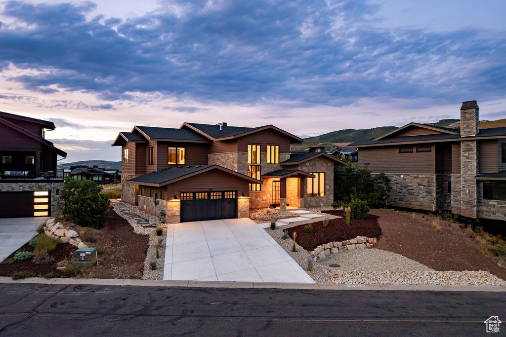 Contemporary exterior featuring stone accents and dark wood siding