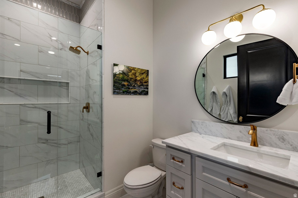 Glass-enclosed shower with tiled walls and built-in niches