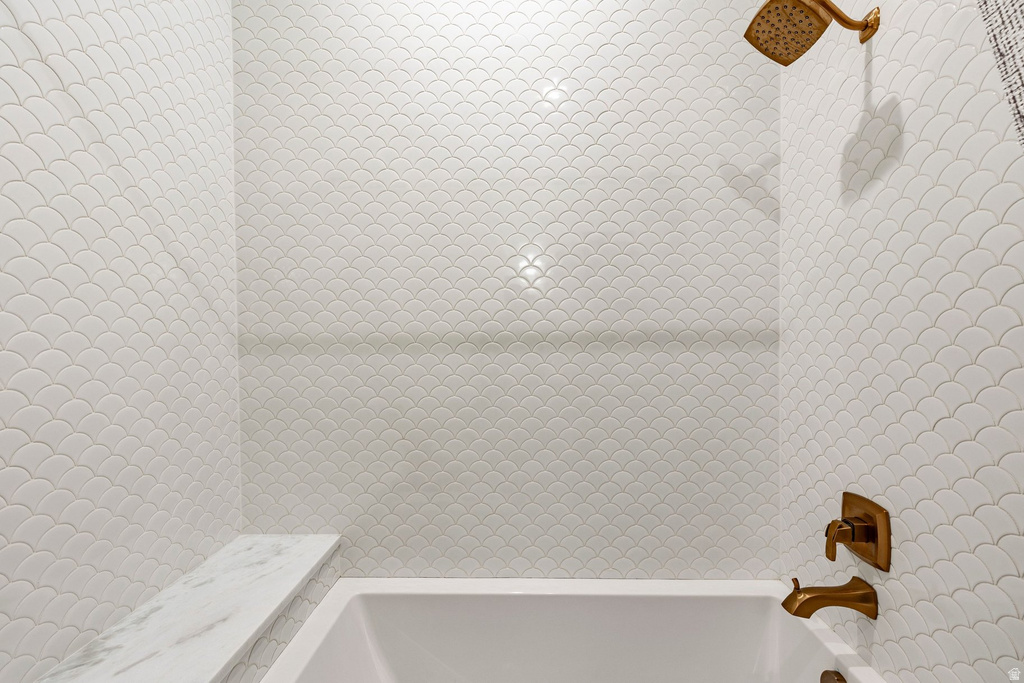 Shower-tub combination featuring a white soaking tub