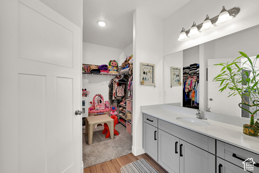 Built-in shelving and hanging rods within the closet