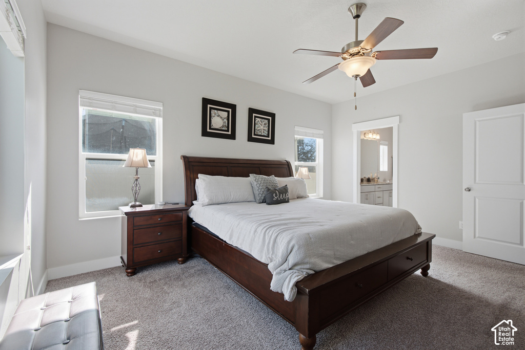 Neutral wall tones with carpet flooring, featuring a ceiling fan with integrated lighting