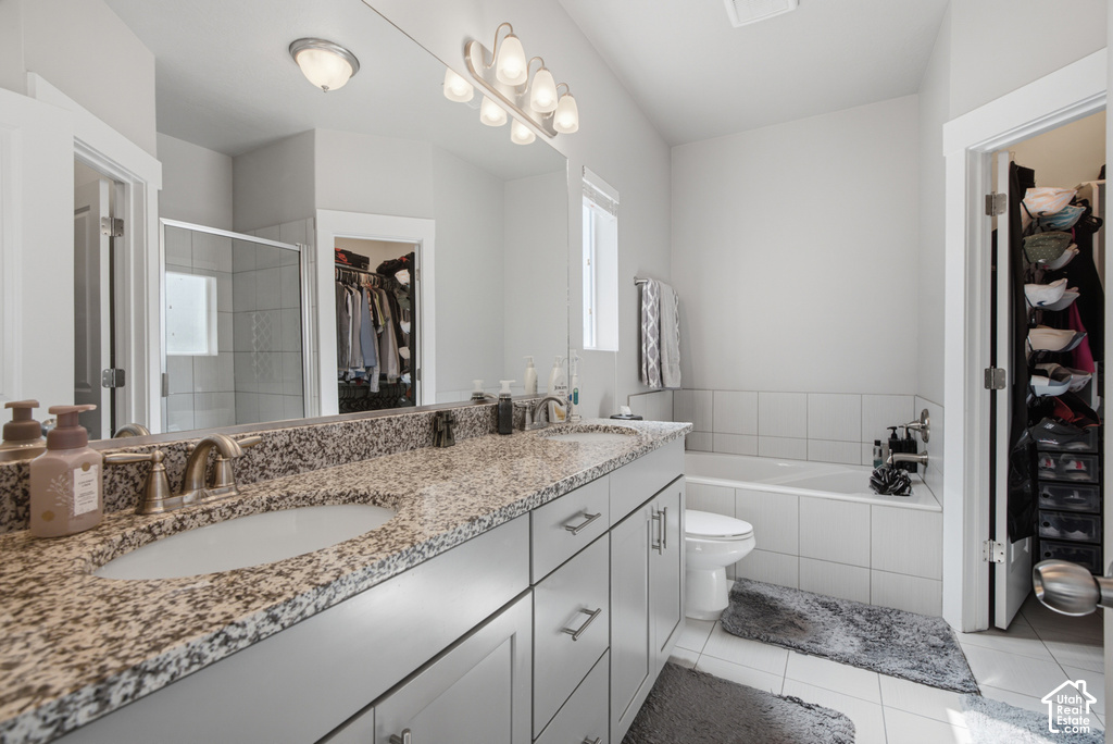 Dual vanity with granite countertops, light gray cabinetry, and brushed nickel fixtures