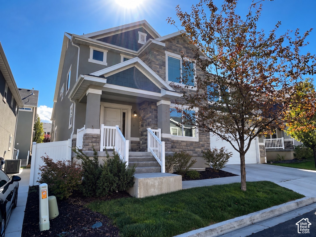 Stone and stucco exterior with white trim details