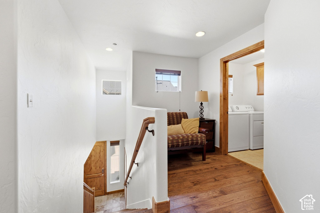 Wood-finish flooring throughout the hallway