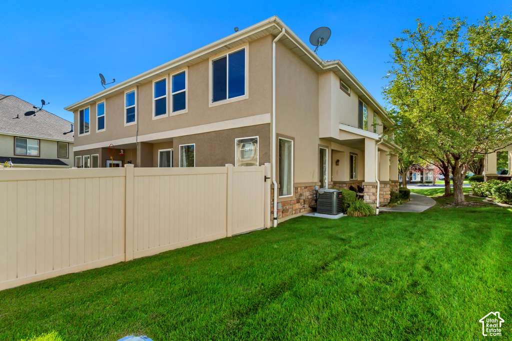 Cream-toned siding exterior with stone veneer accents