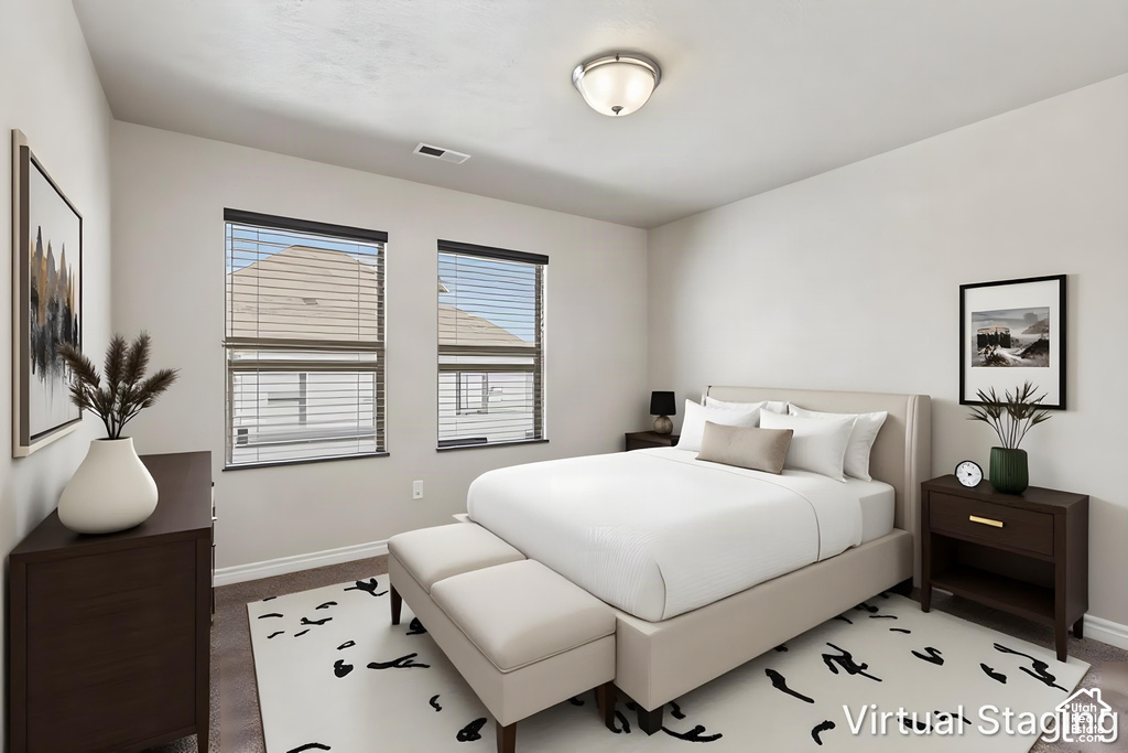 Two windows with blinds, flush mount ceiling light fixture, and wood-finish flooring