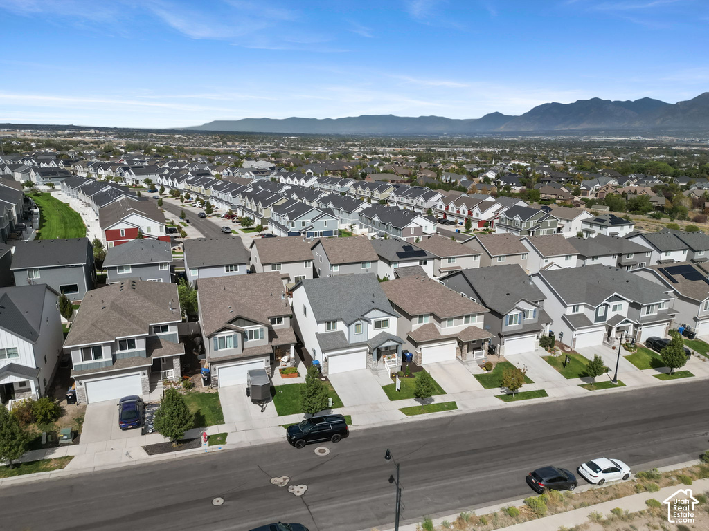 Expansive residential development featuring a variety of home styles, multiple garages, and paved streets