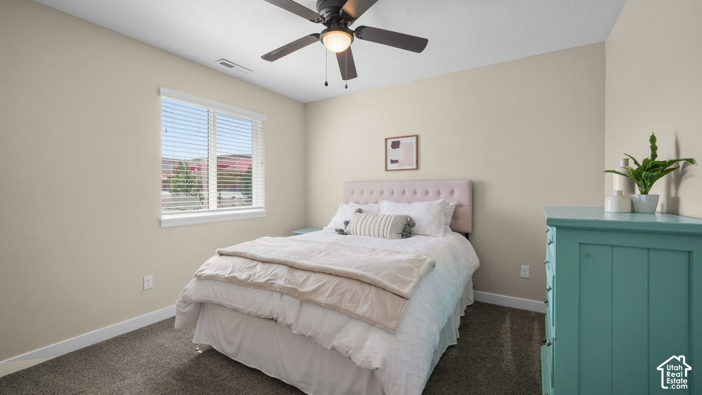 Recessed window with blinds, overhead ceiling fan with lighting, and carpeting