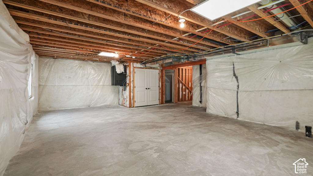 Concrete flooring with exposed ceiling joists and support beams