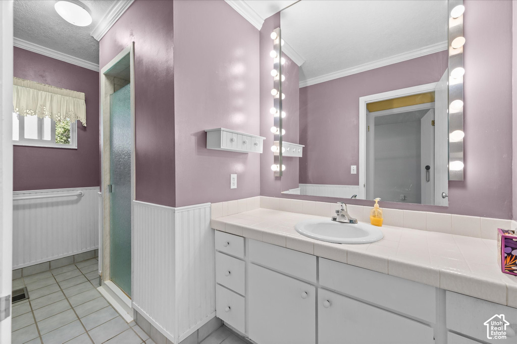Vanity with integrated sink, integrated wall mirror, and surrounding vanity lighting
