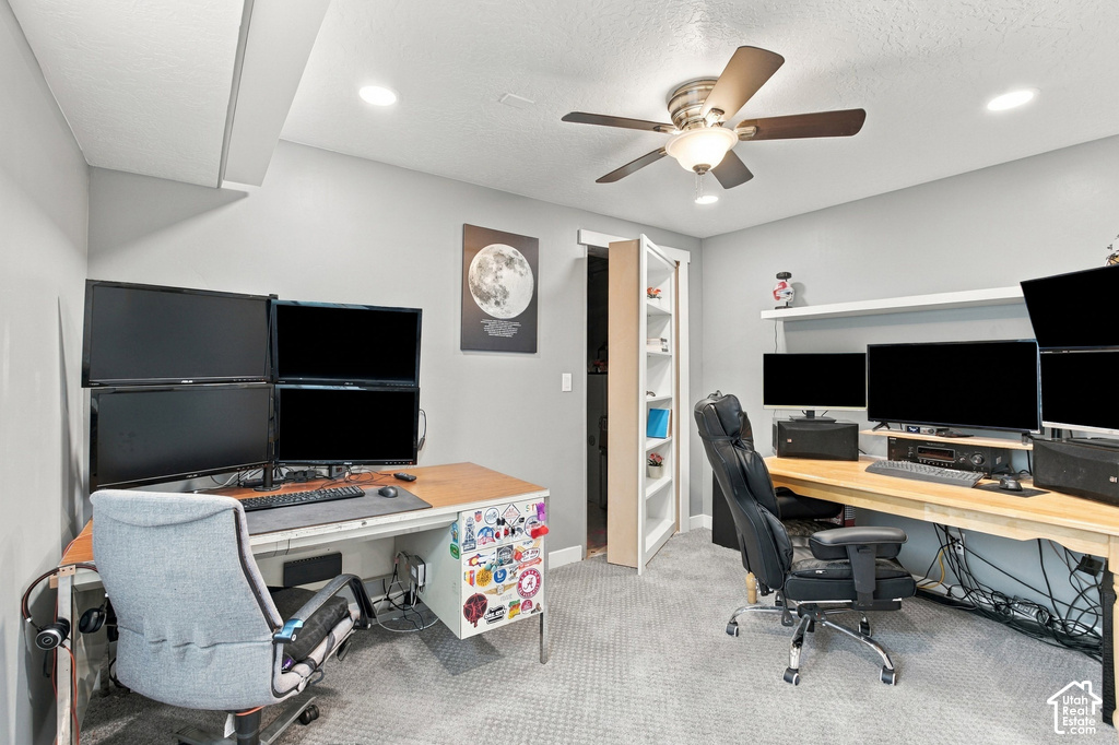 Carpeted room featuring recessed lighting, a ceiling fan, and built-in shelving