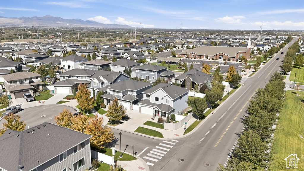 Residential development featuring a mix of single-family homes, clear skies, and a defined road network