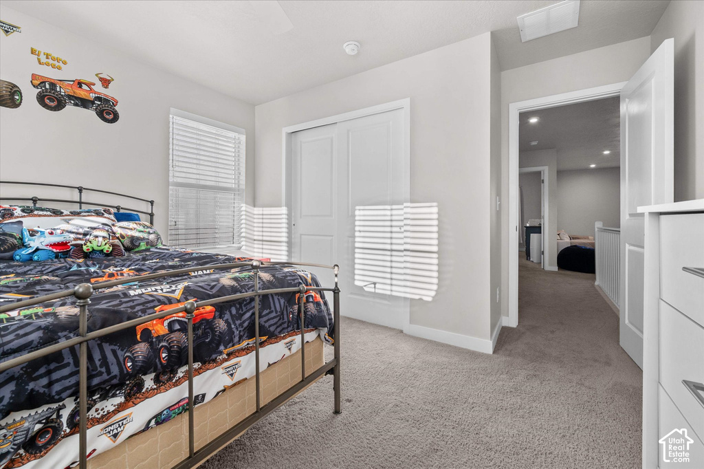 Neutral-toned walls complement plush carpeting