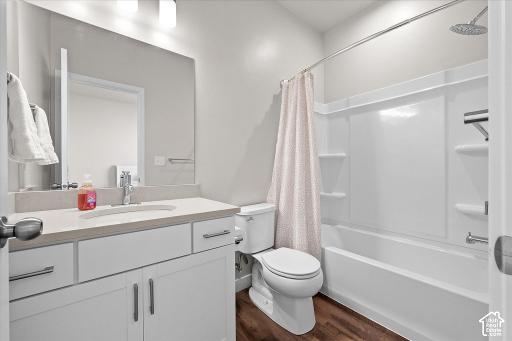 White vanity with stone-finish countertop and undermount sink