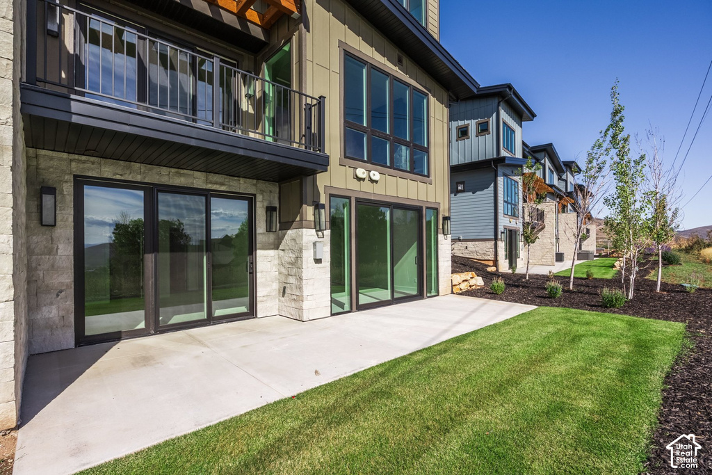 Ground-level patio with sliding glass door access