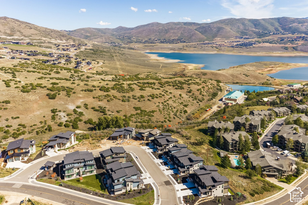 Newly constructed homes with modern architecture, paved roads, and lush landscaping