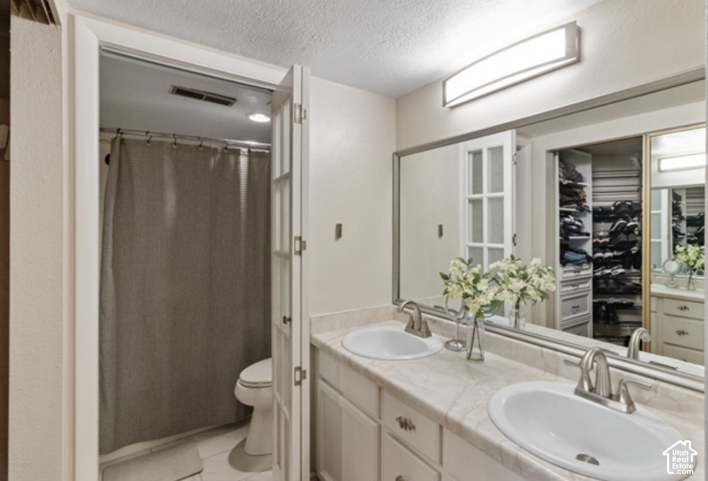 Dual vanity with undermount sinks and brushed nickel faucets