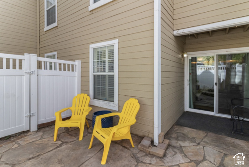 Private outdoor patio with flagstone paving and an adjacent sliding glass door