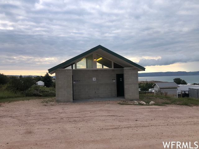 View of garage at dusk