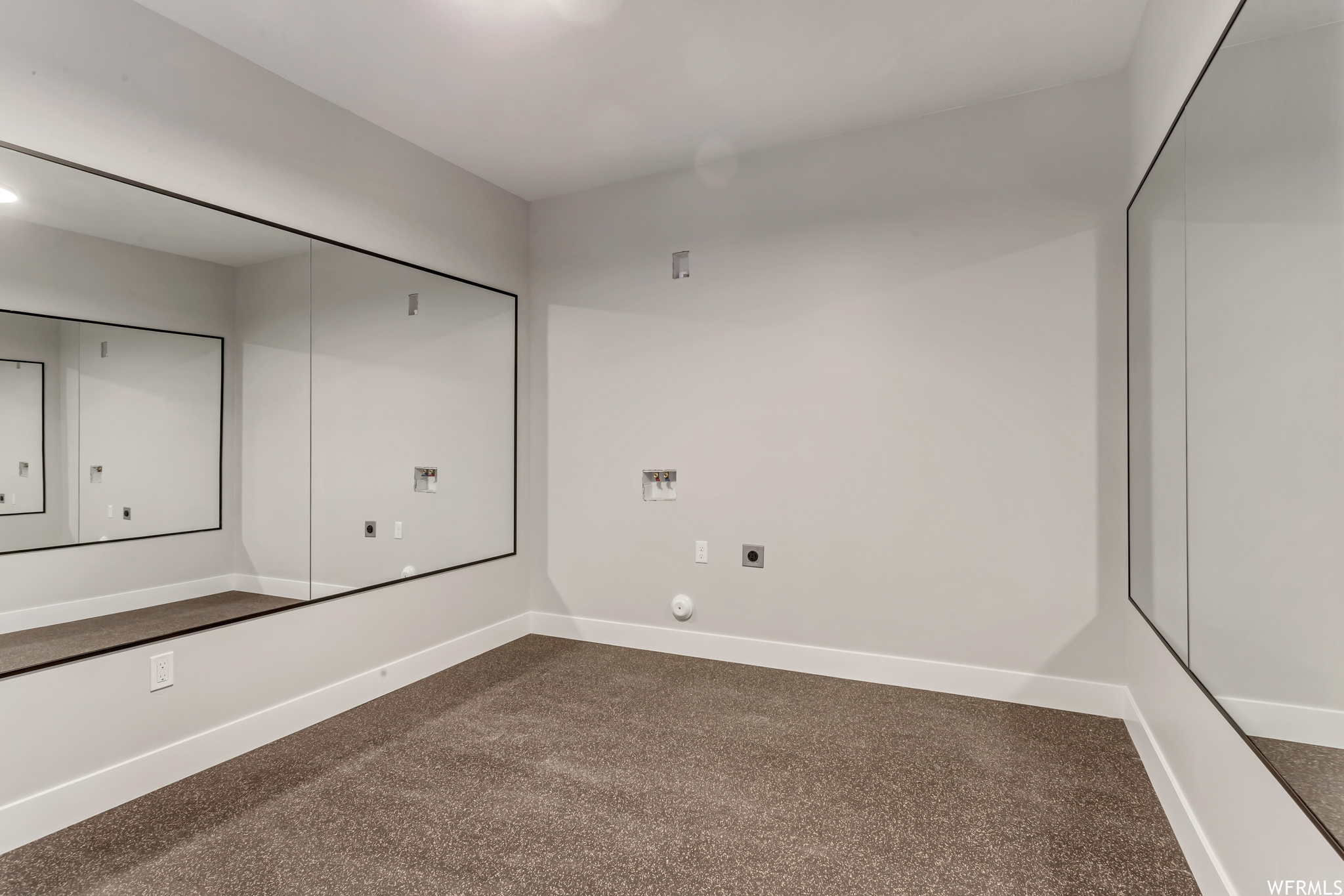 This owner chose gym flooring and mirrors for this room