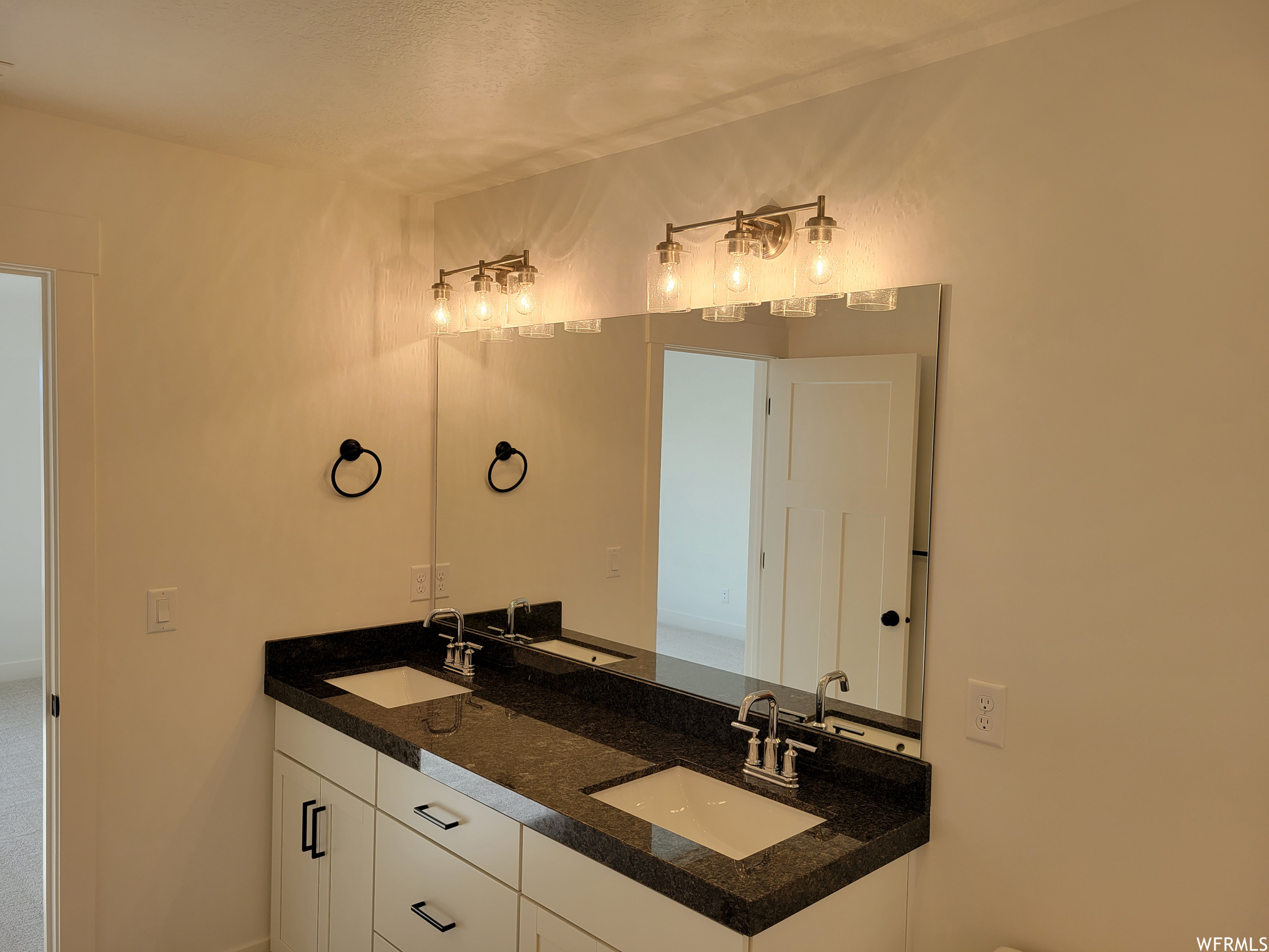 Bathroom with double vanity and mirror