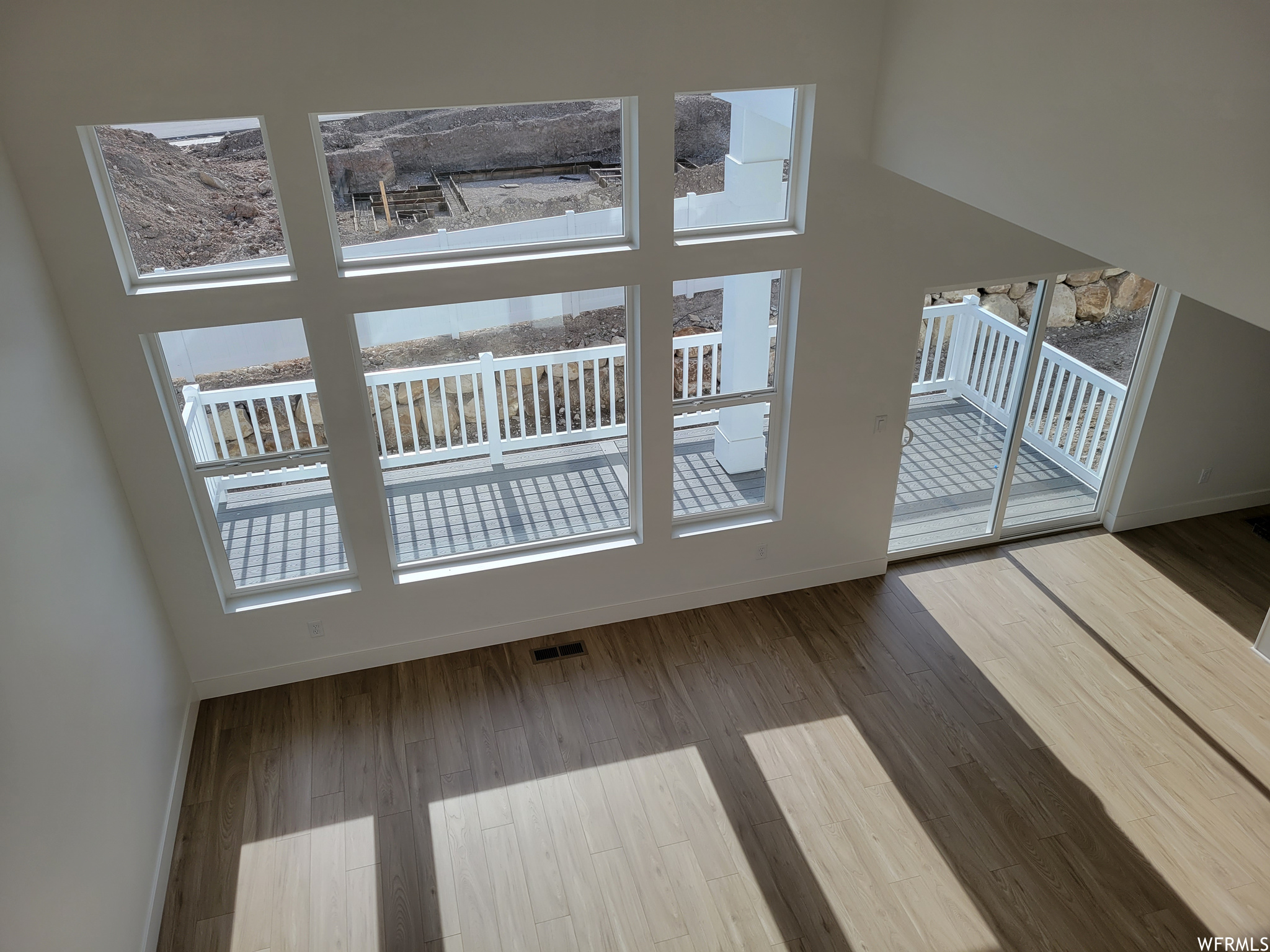 Doorway to outside featuring wood-type flooring