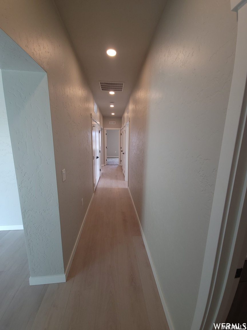 Corridor with wood-type flooring