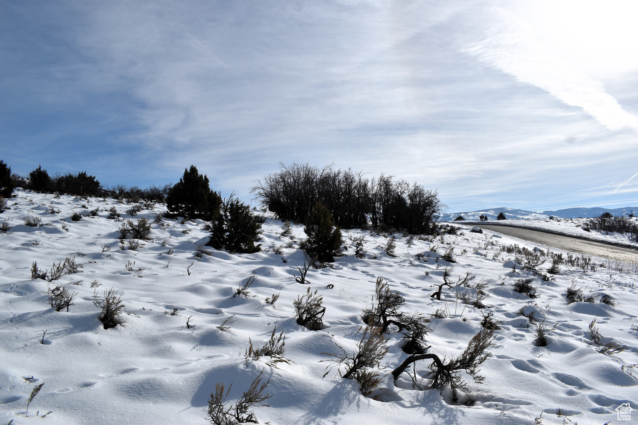 View of snow covered land featuring a mountain view