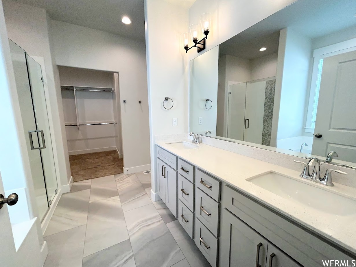 Beautiful Master bath with double sink vanity,  relaxing soaker tub and separate shower.