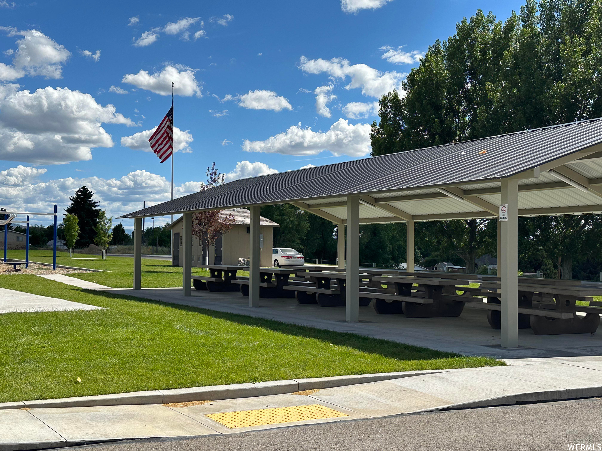 View of property's community featuring a yard