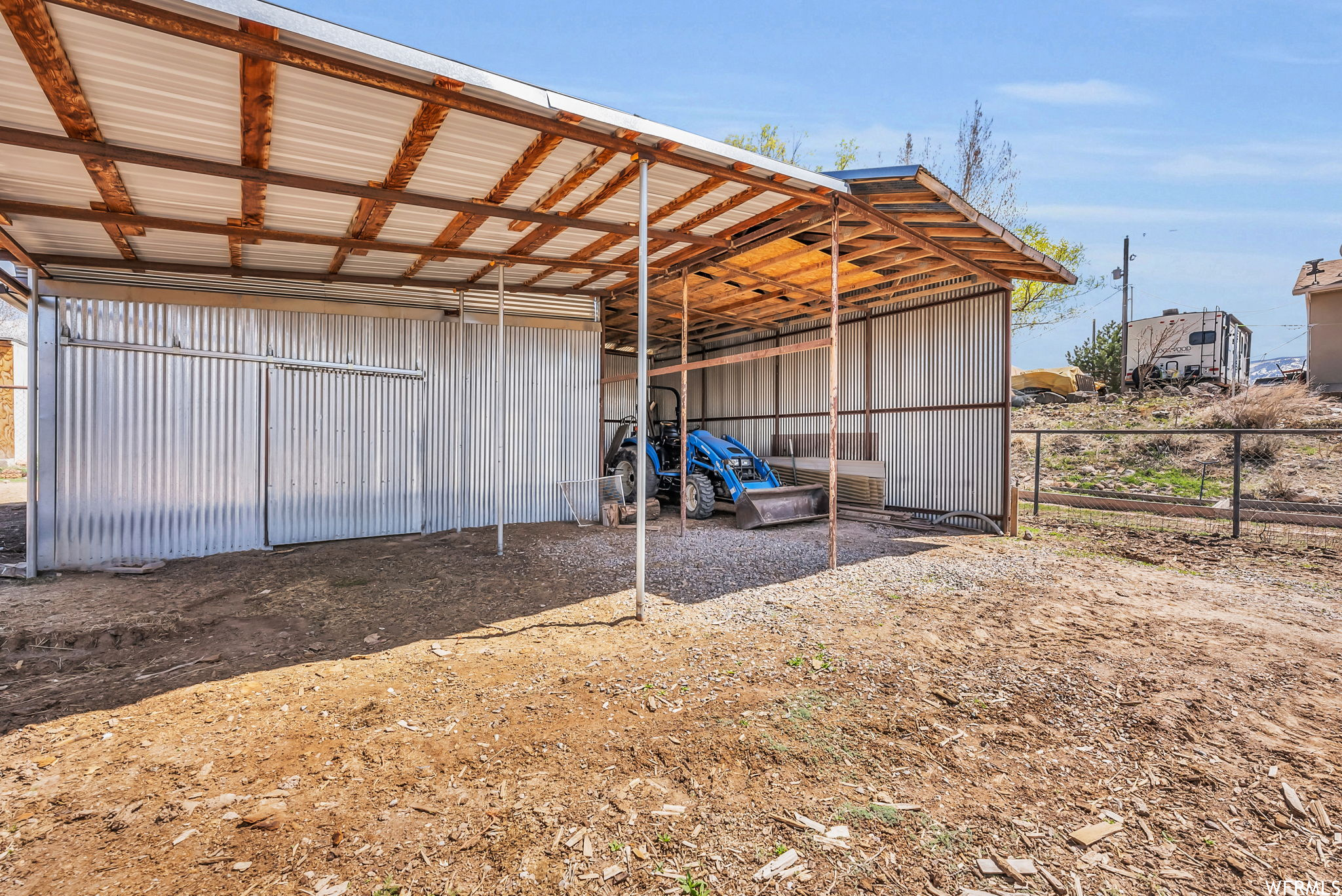 Tractor storage and tack shed