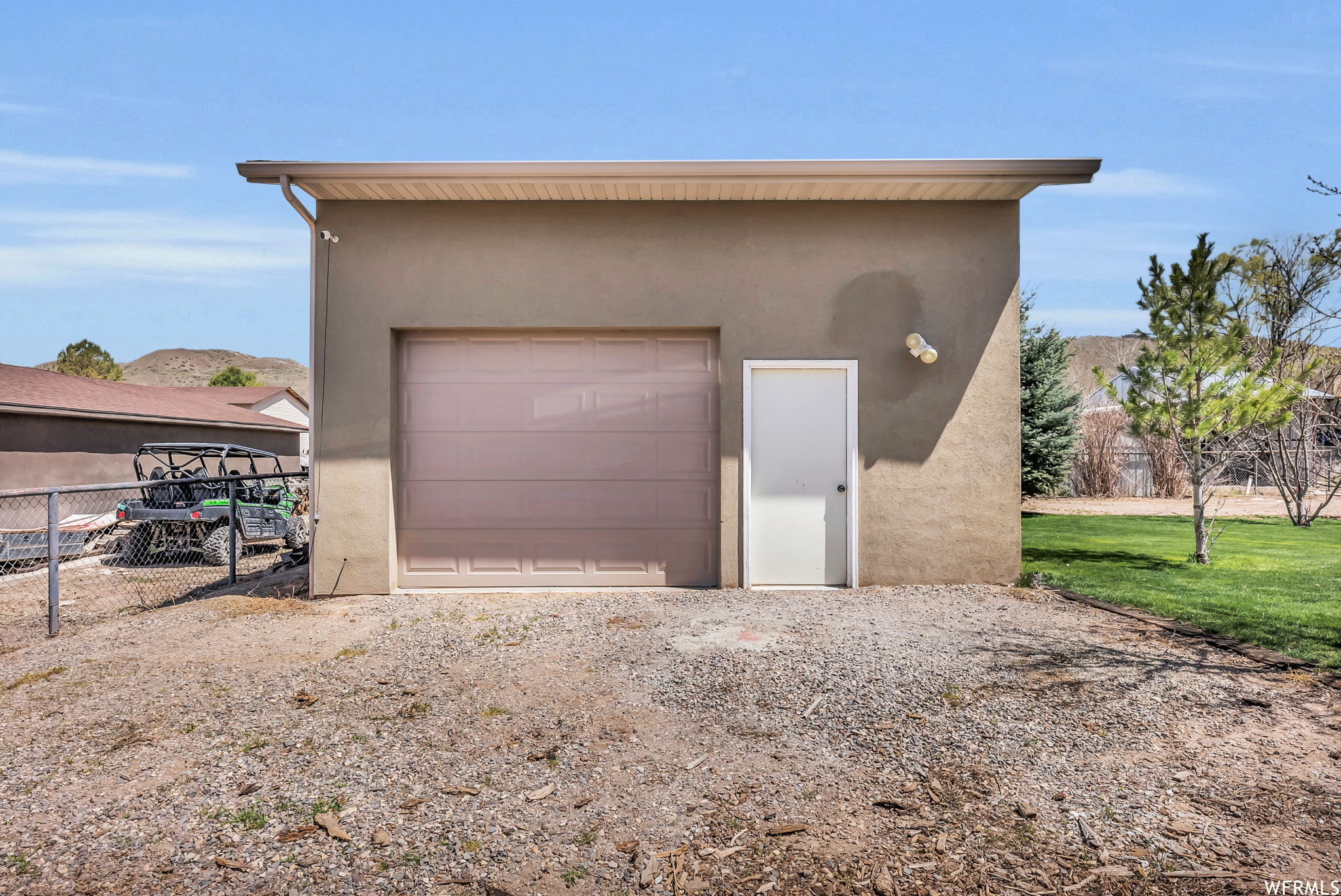 Garage featuring a yard