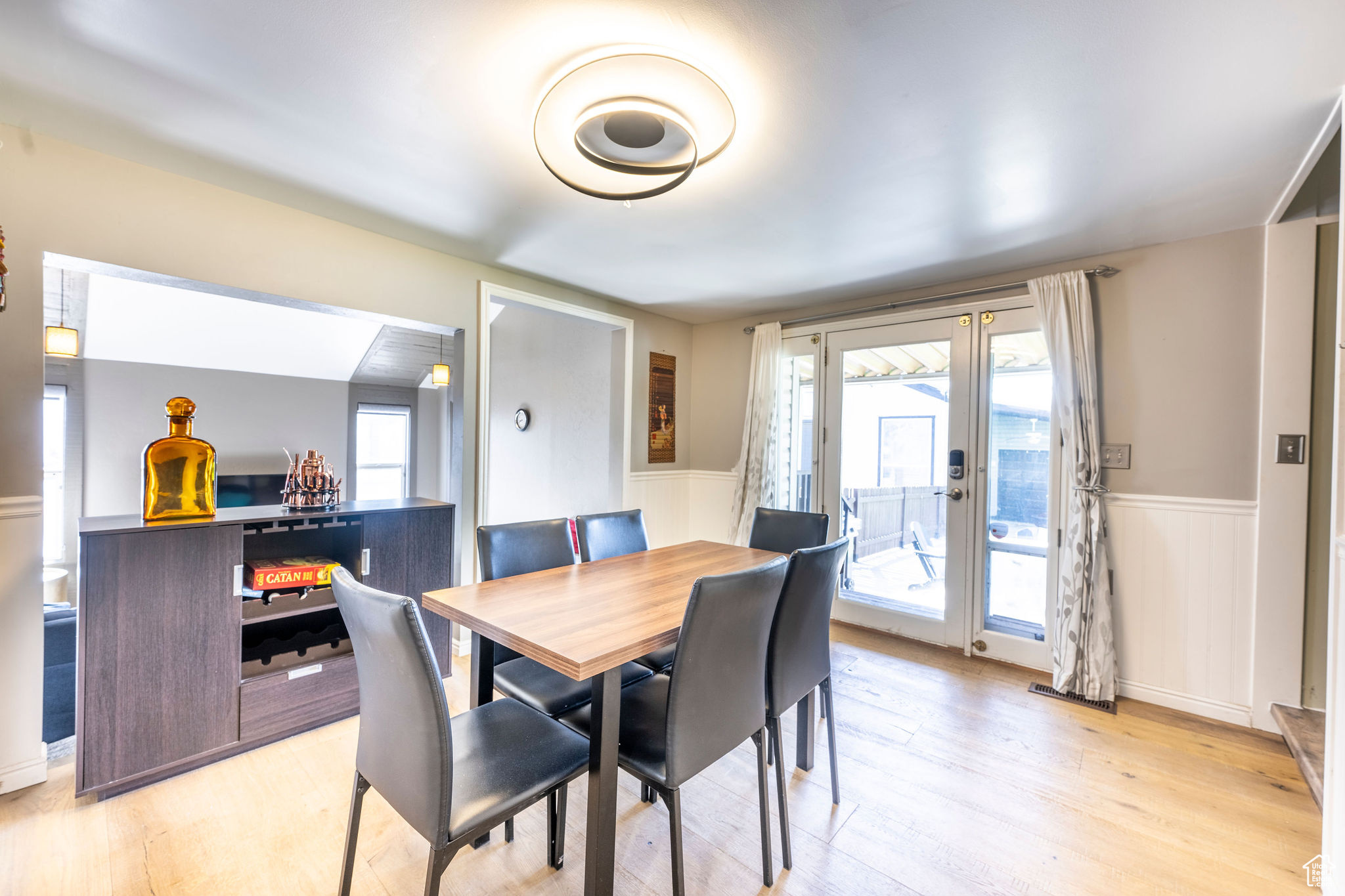 Dining room with light hardwood / wood-style flooring