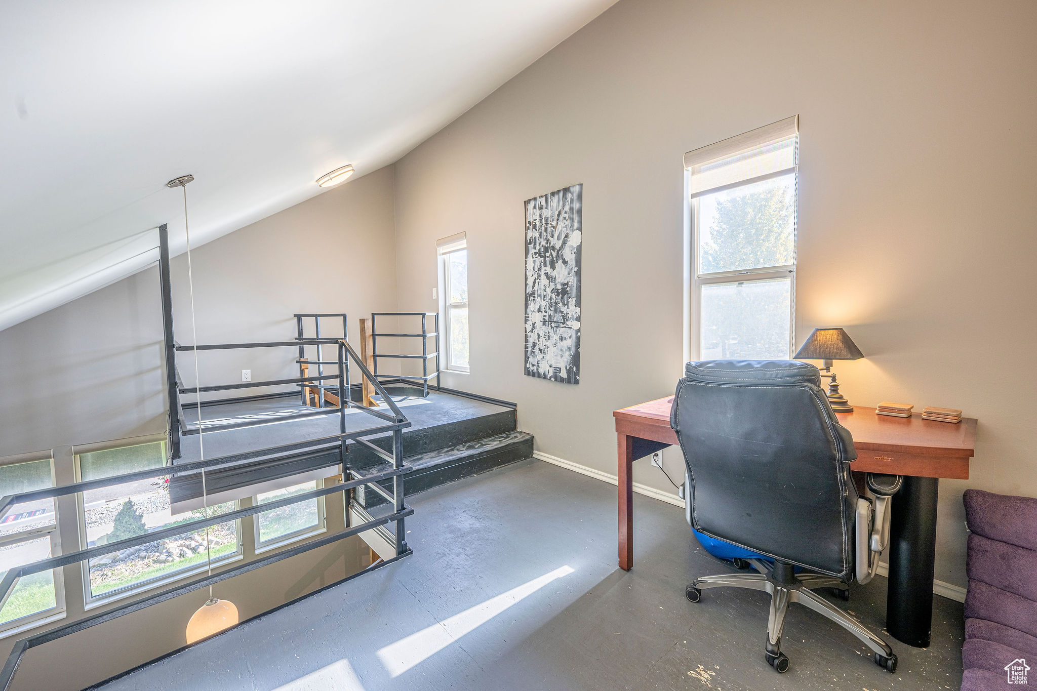 Office area with lofted ceiling